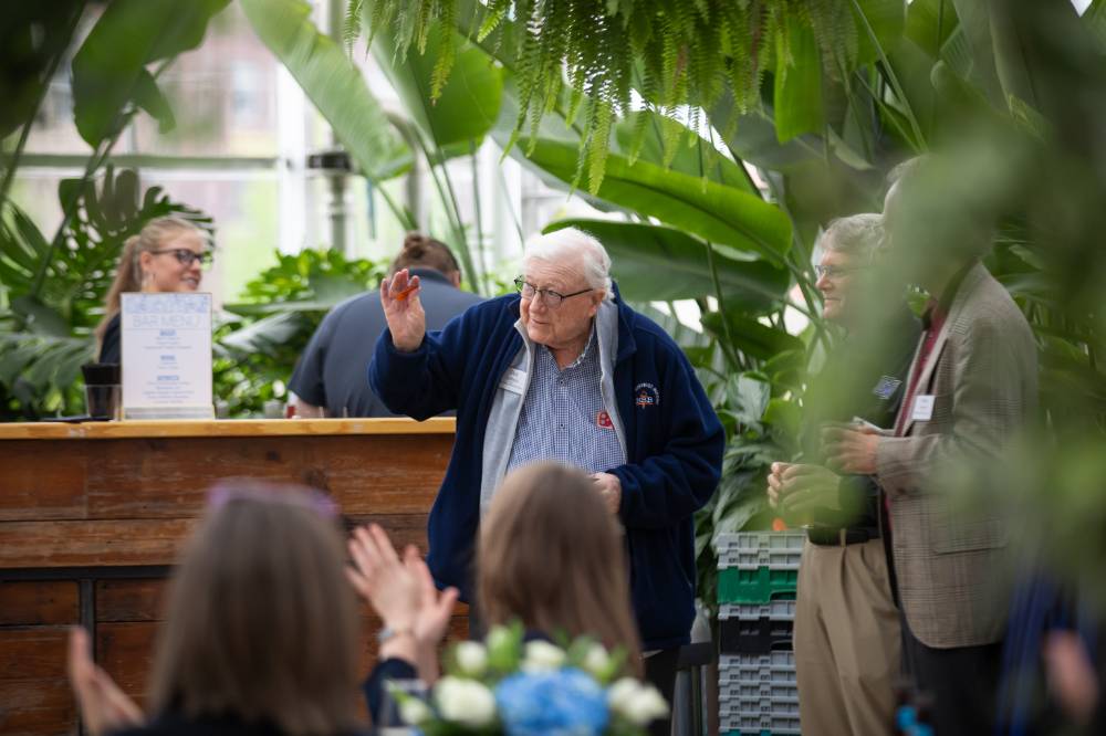 The legend, President Emeritus Don Lubbers waving at someone